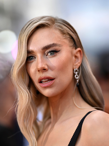vanessa kirby with long wavy blonde hair and bushy brows '70s makeup trend