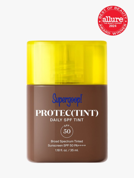 sunscreen in branded clear bottle with yellow cap on light gray background with red and white 2024 allure best of beauty seal